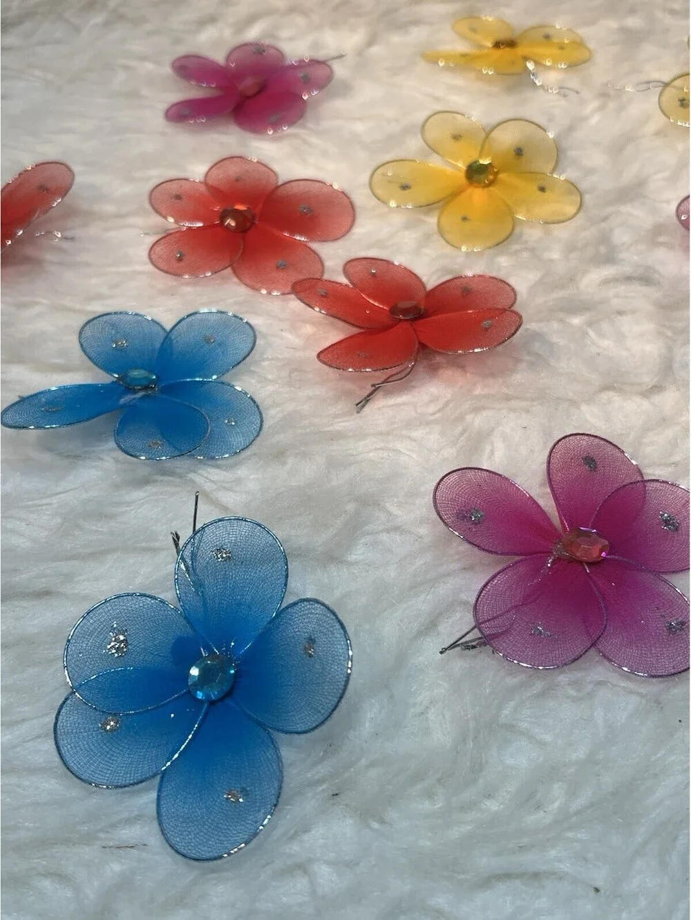 Lot of multicolored sparkling mesh and rhinestone flowers